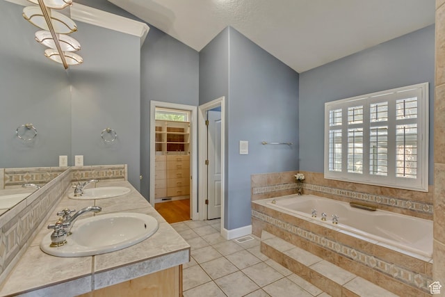 11362 Palisade View Dr, South Jordan, UT 84095 - bathroom featuring a garden tub, a sink, tile patterned floors, and double vanity