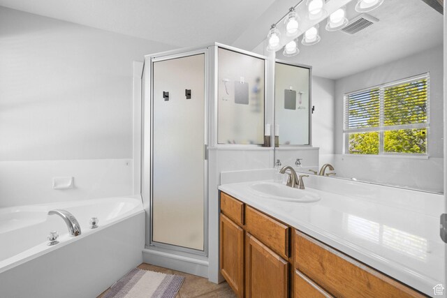 10751 S Pine Shadow Rd W, South Jordan, UT 84009 - full bath with vanity, a stall shower, and a garden tub