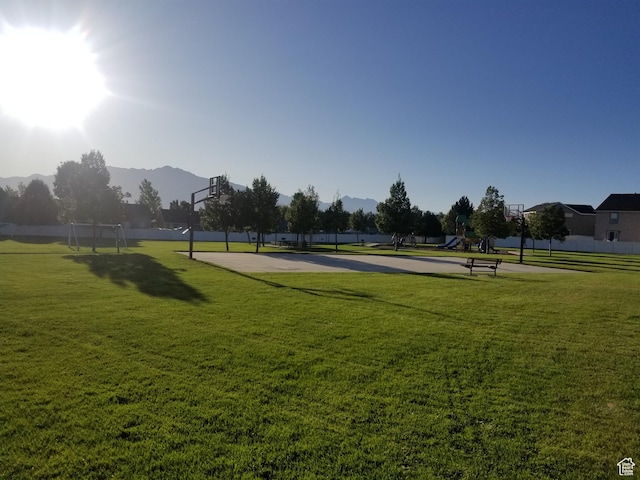 10751 S Pine Shadow Rd W, South Jordan, UT 84009 - view of home's community with a mountain view, a lawn, and community basketball court