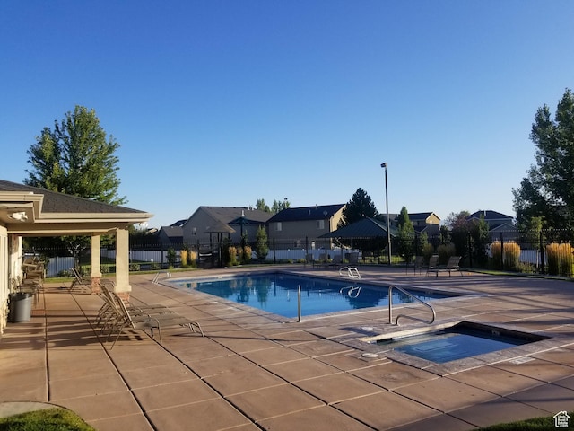 10751 S Pine Shadow Rd W, South Jordan, UT 84009 - community pool with a community hot tub, fence, a patio, and a residential view