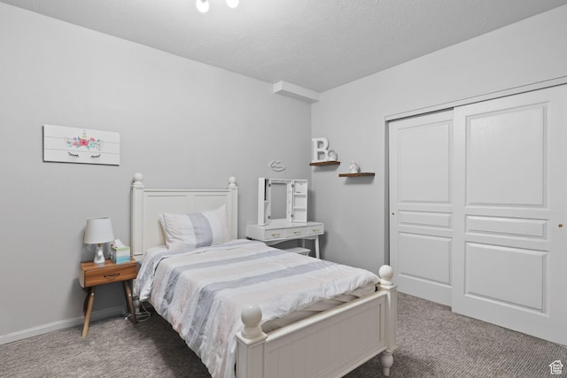 10751 S Pine Shadow Rd W, South Jordan, UT 84009 - carpeted bedroom with a closet, a textured ceiling, and baseboards