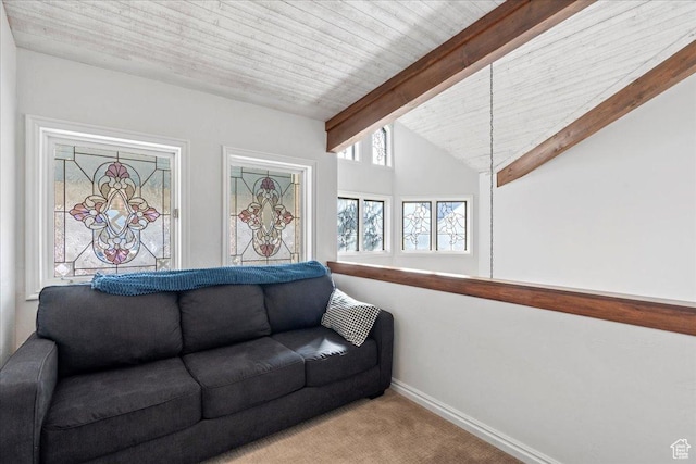 living area featuring carpet flooring, baseboards, and lofted ceiling with beams