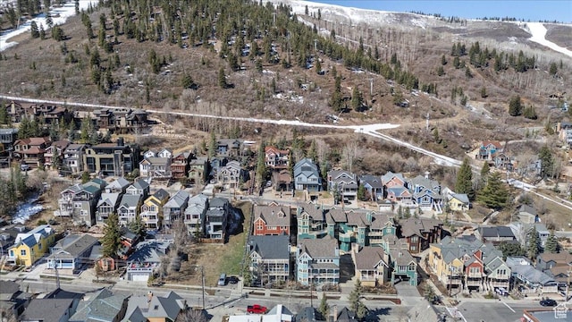 drone / aerial view featuring a residential view and a mountain view