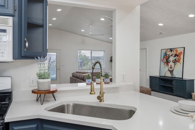 1864 S Crockett Cir, Bloomington, UT 84790 - kitchen with light countertops, a sink, and blue cabinets