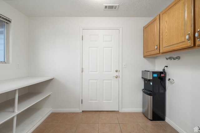 1864 S Crockett Cir, Bloomington, UT 84790 - laundry area with light tile patterned floors, baseboards, and visible vents
