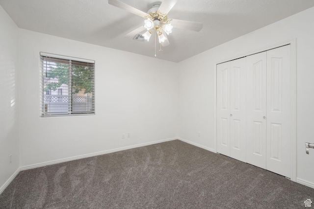 1864 S Crockett Cir, Bloomington, UT 84790 - unfurnished bedroom with baseboards, ceiling fan, carpet, and a closet