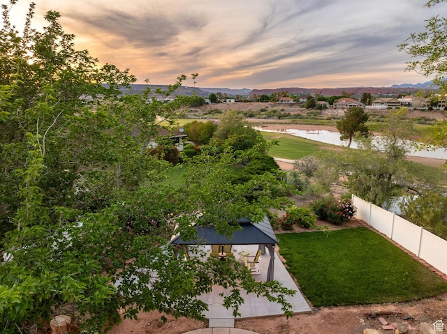 1864 S Crockett Cir, Bloomington, UT 84790 - aerial view at dusk featuring a water and mountain view