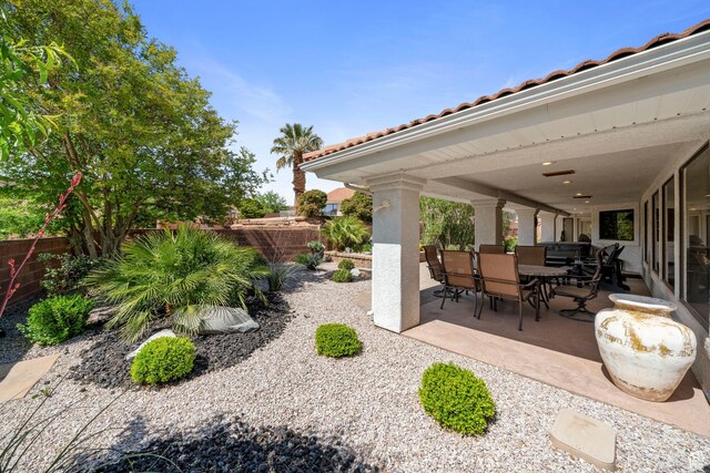 1026 Wesley Powell Dr, St George, UT 84790 - view of patio with a fenced backyard and outdoor dining space