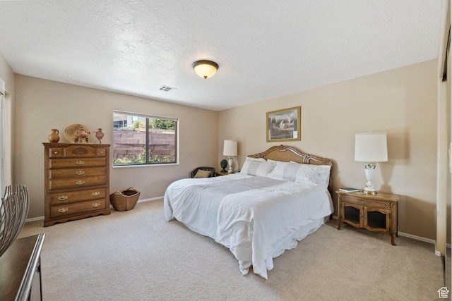 1026 Wesley Powell Dr, St George, UT 84790 - bedroom with light colored carpet, a textured ceiling, baseboards, and visible vents