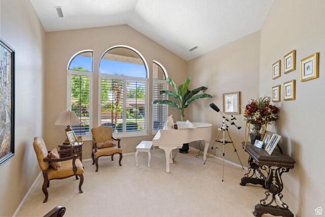 1026 Wesley Powell Dr, St George, UT 84790 - sitting room with visible vents, carpet, baseboards, and vaulted ceiling