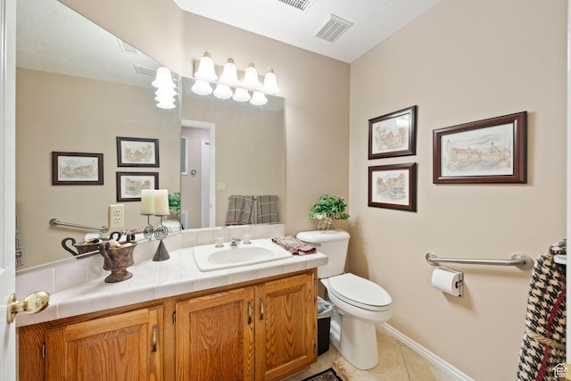 1026 Wesley Powell Dr, St George, UT 84790 - bathroom featuring visible vents, tile patterned flooring, vanity, baseboards, and toilet