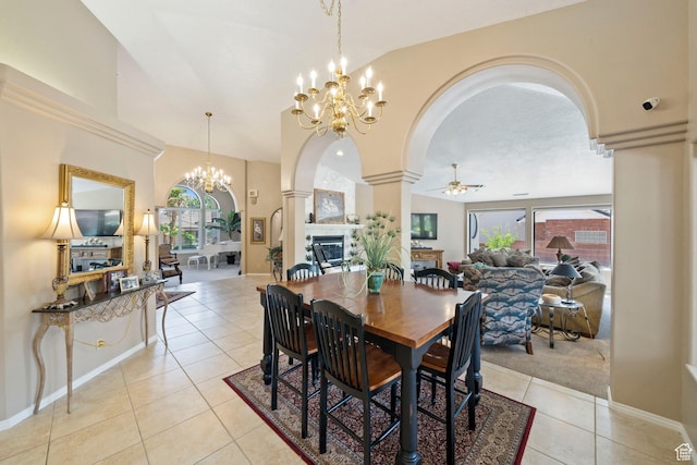 1026 Wesley Powell Dr, St George, UT 84790 - dining space featuring a healthy amount of sunlight, decorative columns, arched walkways, light tile patterned floors, and ceiling fan with notable chandelier