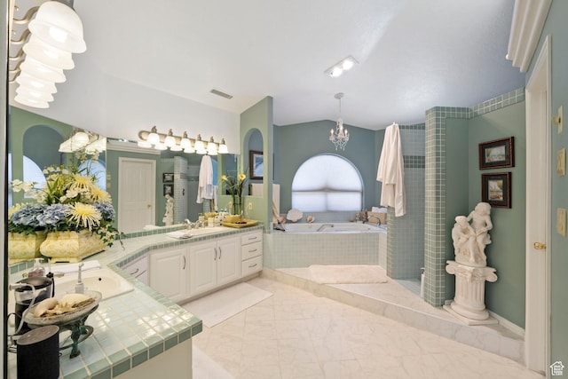 1026 Wesley Powell Dr, St George, UT 84790 - bathroom with a garden tub, a chandelier, visible vents, vanity, and marble finish floor