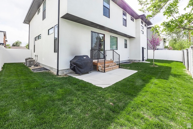 883 E Sydnee View Ln, Millcreek, UT 84107 - back of house with a patio, a fenced backyard, stucco siding, and a yard