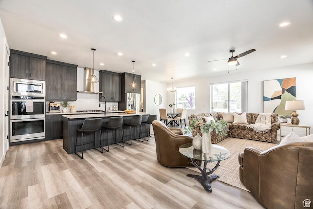 883 E Sydnee View Ln, Millcreek, UT 84107 - living area with recessed lighting, ceiling fan, and light wood finished floors