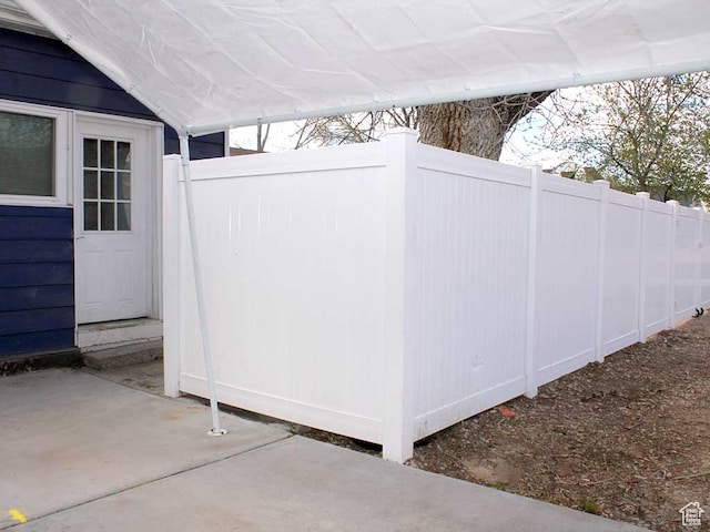 view of patio featuring fence