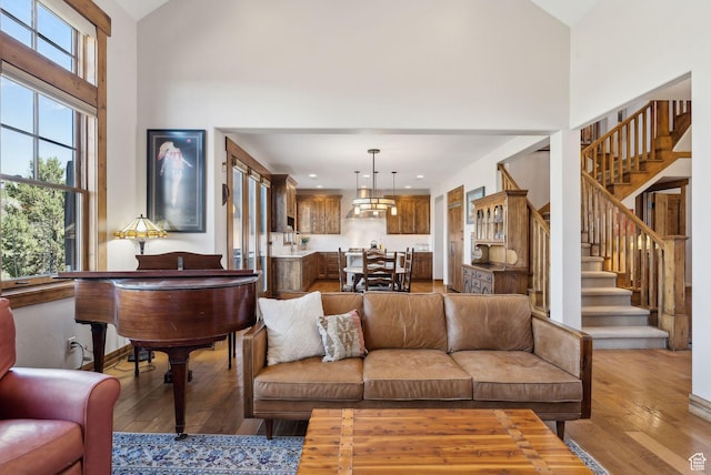 3250 E Thunderhawk Trl, Heber City, UT 84036 - living area featuring stairway, recessed lighting, hardwood / wood-style floors, and a towering ceiling