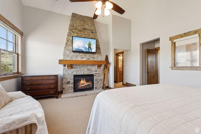 3250 E Thunderhawk Trl, Heber City, UT 84036 - bedroom with carpet floors, a ceiling fan, high vaulted ceiling, and a stone fireplace