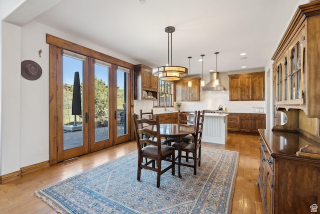 3250 E Thunderhawk Trl, Heber City, UT 84036 - dining room featuring wood-type flooring, visible vents, baseboards, recessed lighting, and french doors