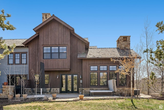 3250 E Thunderhawk Trl, Heber City, UT 84036 - rear view of house featuring french doors, a chimney, central AC, and stone siding
