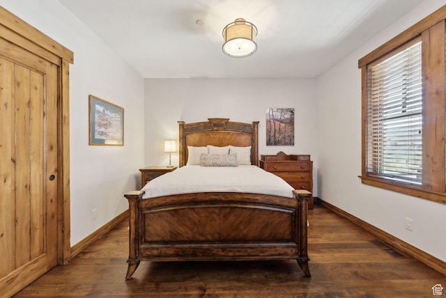 3250 E Thunderhawk Trl, Heber City, UT 84036 - bedroom featuring baseboards and dark wood-style floors