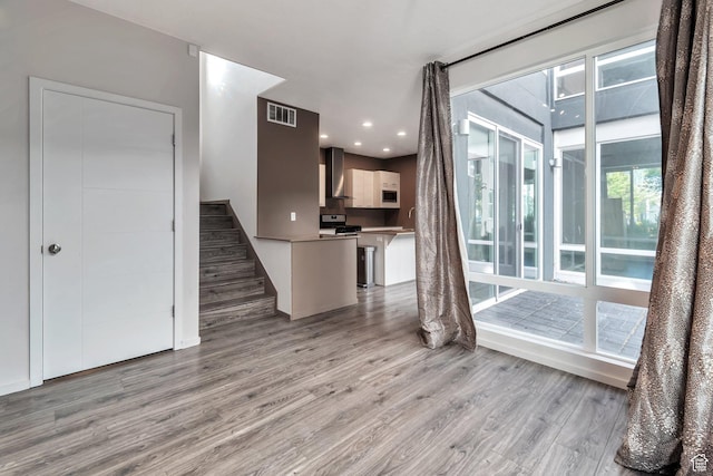 11611 S Alexandria W, South Jordan, UT 84009 - unfurnished living room featuring recessed lighting, visible vents, stairway, and light wood-style floors