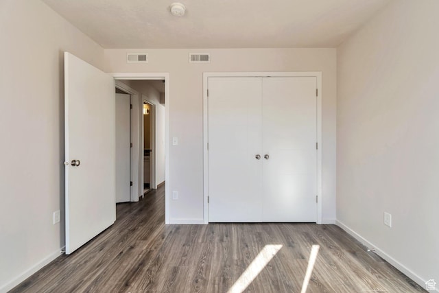 11611 S Alexandria W, South Jordan, UT 84009 - unfurnished bedroom with visible vents, baseboards, wood finished floors, and a closet