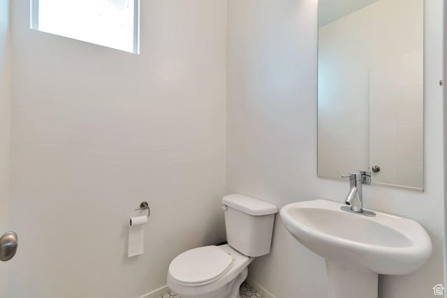 11611 S Alexandria W, South Jordan, UT 84009 - bathroom featuring toilet, baseboards, and a sink