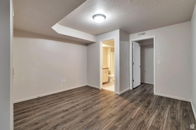 11611 S Alexandria W, South Jordan, UT 84009 - interior space with visible vents, a textured ceiling, baseboards, and dark wood-style floors