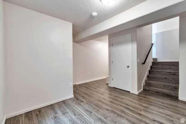 11611 S Alexandria W, South Jordan, UT 84009 - finished below grade area with baseboards, a textured ceiling, and wood finished floors