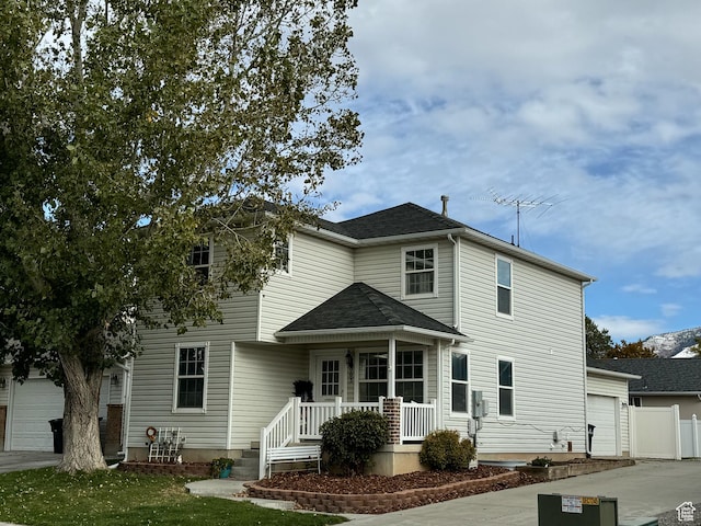 863 S 1520 E, Spanish Fork, UT 84660 - traditional-style house with an attached garage, covered porch, and driveway