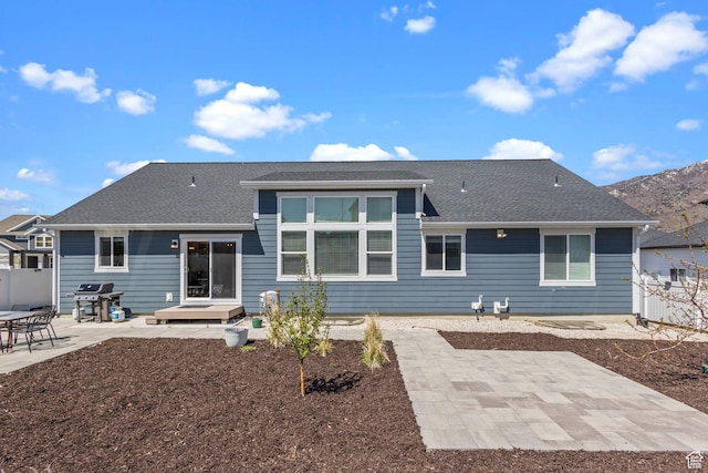 2438 E Lone Hill Dr, Draper, UT 84020 - back of house featuring a patio area, roof with shingles, and fence