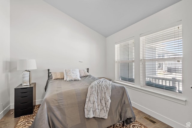 2438 E Lone Hill Dr, Draper, UT 84020 - bedroom featuring baseboards, multiple windows, lofted ceiling, and visible vents
