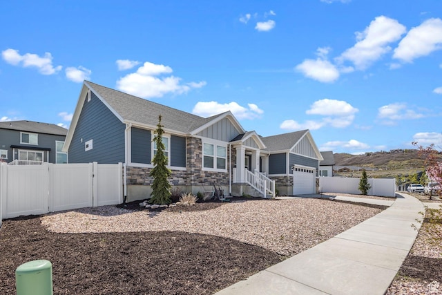 2438 E Lone Hill Dr, Draper, UT 84020 - ranch-style house featuring a garage, board and batten siding, fence, and stone siding