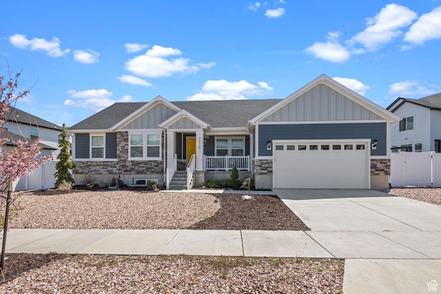 2438 E Lone Hill Dr, Draper, UT 84020 - craftsman inspired home with a garage, covered porch, board and batten siding, and stone siding