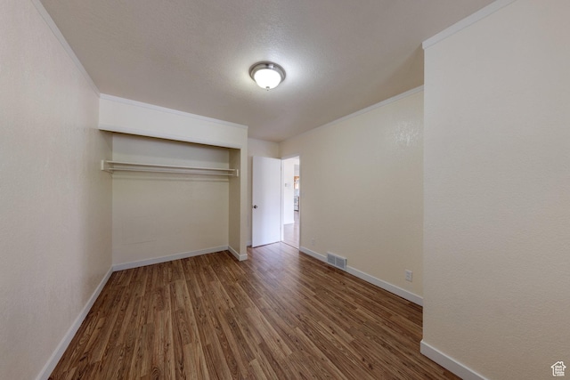 127 Birch Ave, Moab, UT 84532 - unfurnished bedroom with visible vents, wood finished floors, baseboards, a closet, and ornamental molding