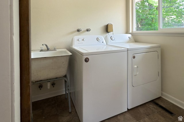 127 Birch Ave, Moab, UT 84532 - laundry room featuring laundry area, a sink, washing machine and dryer, and visible vents