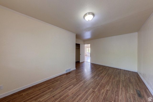127 Birch Ave, Moab, UT 84532 - unfurnished room with visible vents, baseboards, and dark wood-style floors