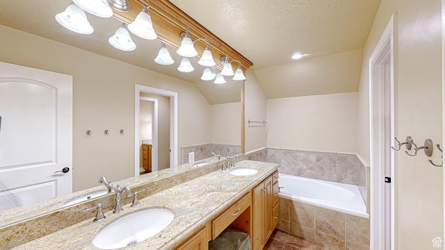 997 W 675 S, Mapleton, UT 84664 - bathroom featuring double vanity, a bath, lofted ceiling, tile patterned flooring, and a textured ceiling