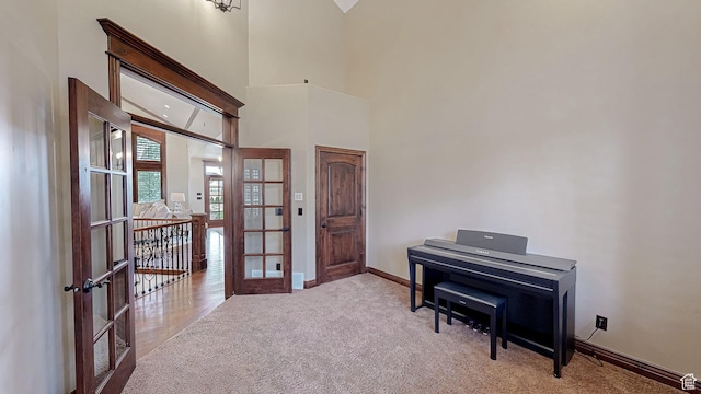 997 W 675 S, Mapleton, UT 84664 - living area featuring french doors, carpet floors, baseboards, and a towering ceiling