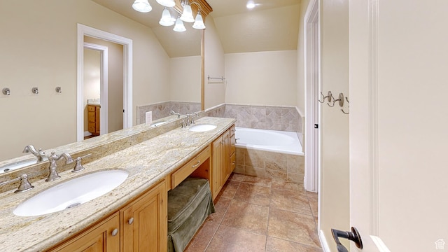 997 W 675 S, Mapleton, UT 84664 - bathroom featuring a bath, double vanity, vaulted ceiling, and tile patterned floors
