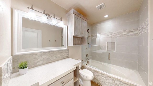 997 W 675 S, Mapleton, UT 84664 - full bathroom featuring tiled shower / bath combo, toilet, tasteful backsplash, vanity, and recessed lighting