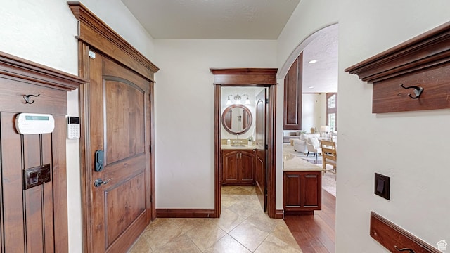 997 W 675 S, Mapleton, UT 84664 - hallway featuring arched walkways, baseboards, and light tile patterned floors