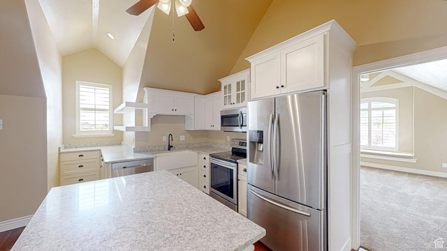997 W 675 S, Mapleton, UT 84664 - kitchen featuring appliances with stainless steel finishes, lofted ceiling, ceiling fan, a center island, and glass insert cabinets
