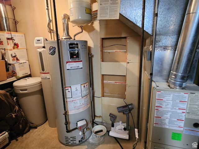 utility room featuring water heater