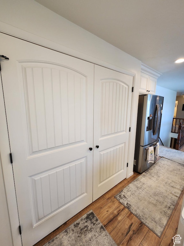 corridor featuring light wood-style floors
