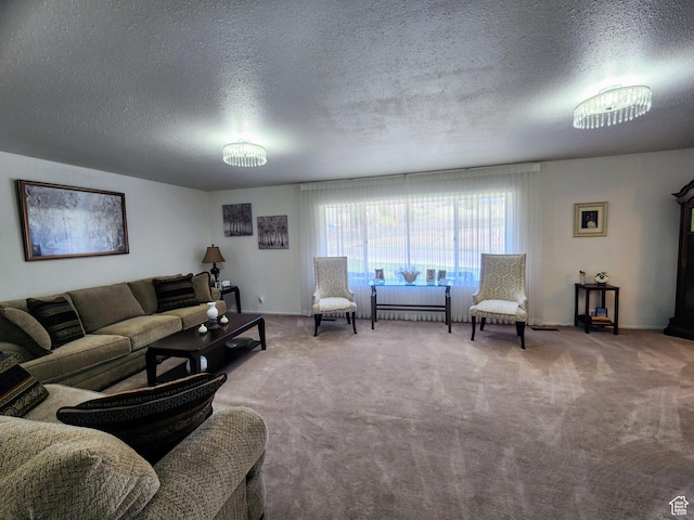 living room with a textured ceiling and carpet flooring