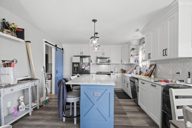 1635 W 700 S, Lehi, UT 84043 - kitchen featuring white cabinets, open shelves, a breakfast bar, a barn door, and stainless steel appliances