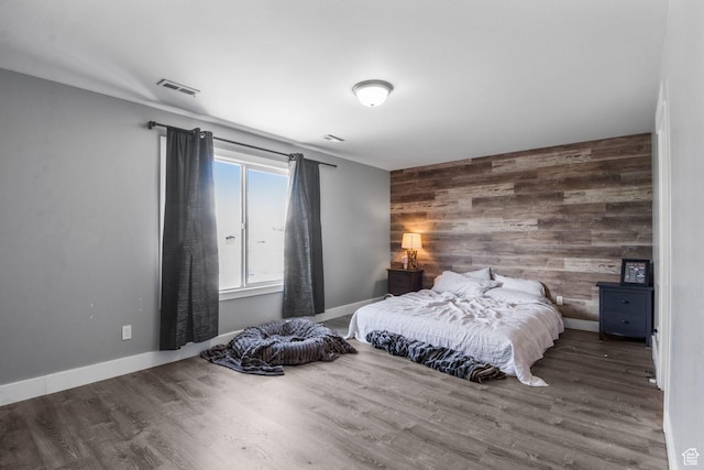 1635 W 700 S, Lehi, UT 84043 - bedroom featuring visible vents, an accent wall, wooden walls, and wood finished floors