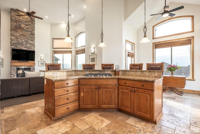 1263 E Wild Maple Ct, Draper, UT 84020 - kitchen featuring high vaulted ceiling, ceiling fan, and stone tile floors